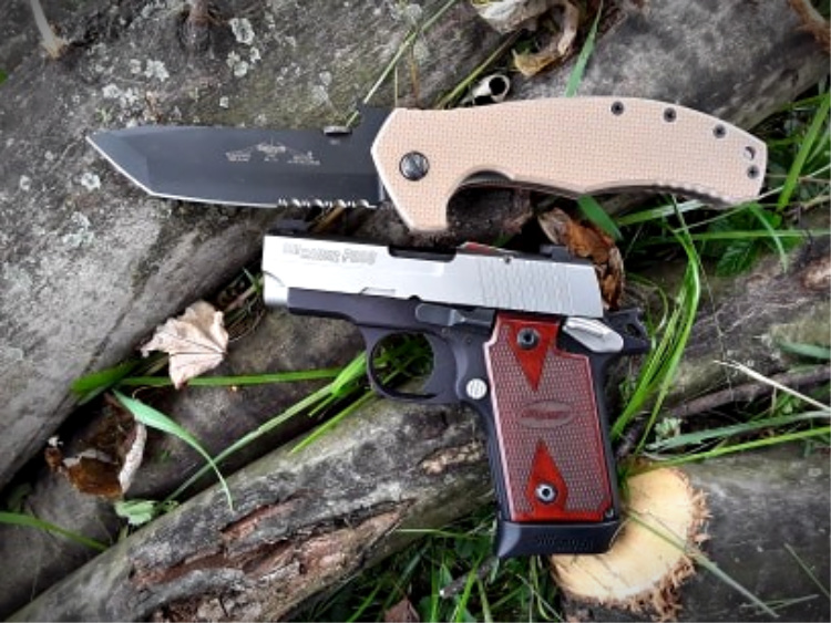 Emerson Roadhouse folding knife with handgun for EDC.